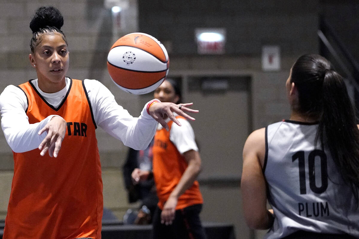 Team Wilson's Candace Parker, left, passes to Kelsey Plum during practice for the WNBA All-Star ...