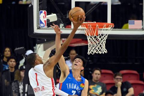 Houston Rockets' Jabari Smith II (1) shoots against Oklahoma City Thunder's Chet Holmgren (7) d ...