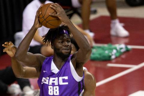 Sacramento Kings center Neemias Queta (88) looks to pass while guarded by Boston Celtics forwar ...