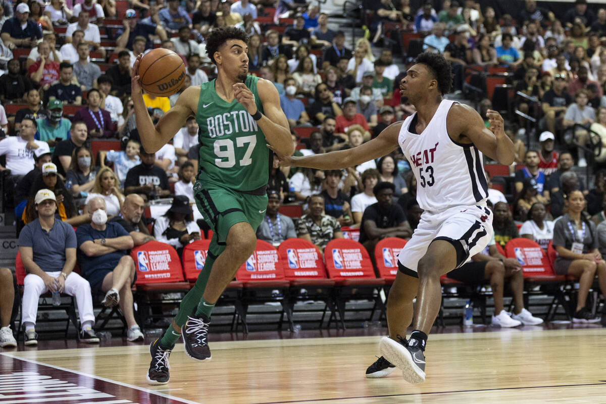 Miami Heat's Bryce Hamilton (53) defends against Boston Celtics' Brodric Thomas (97) in the fir ...