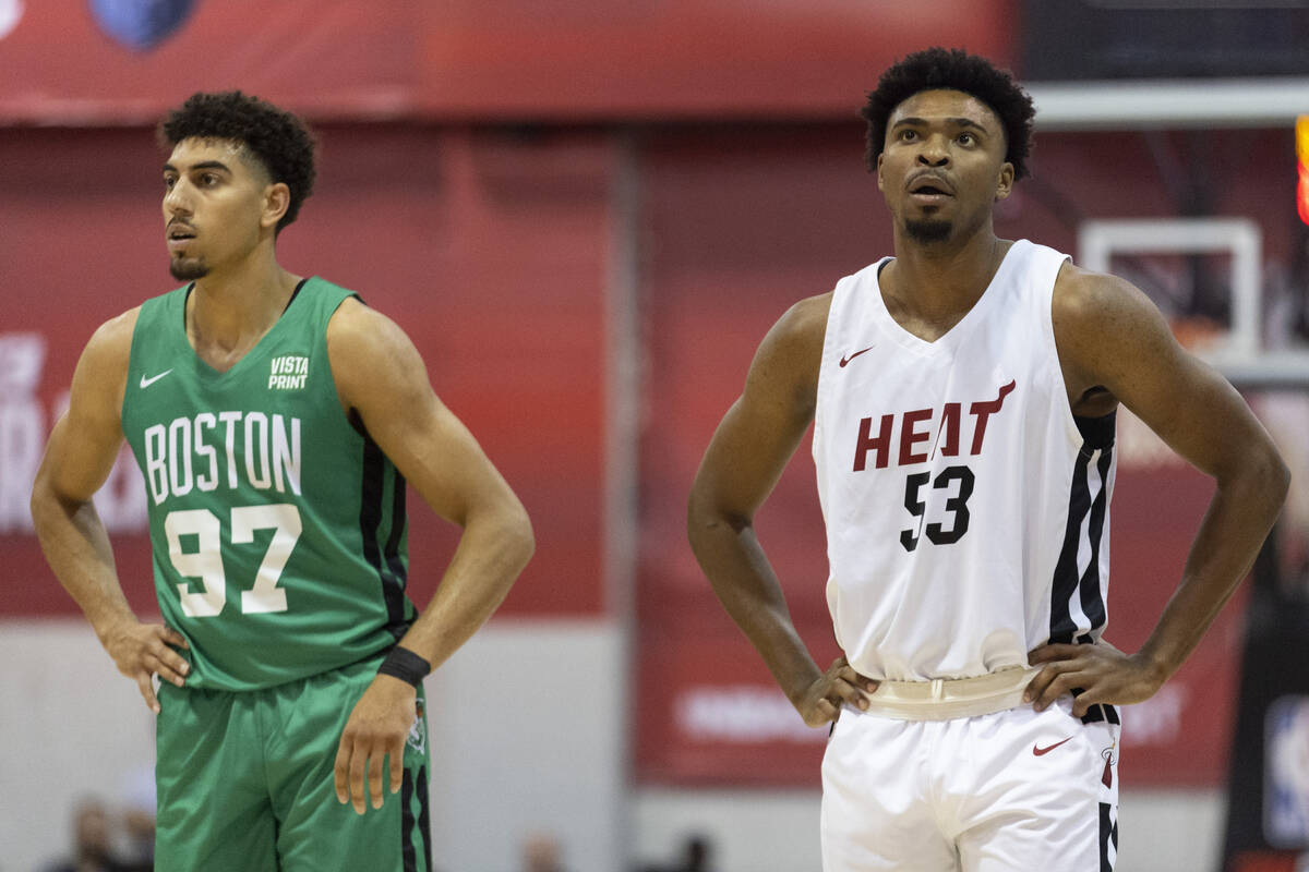 Miami Heat's Bryce Hamilton (53) waits for play to resume with Boston Celtics' Brodric Thomas ( ...