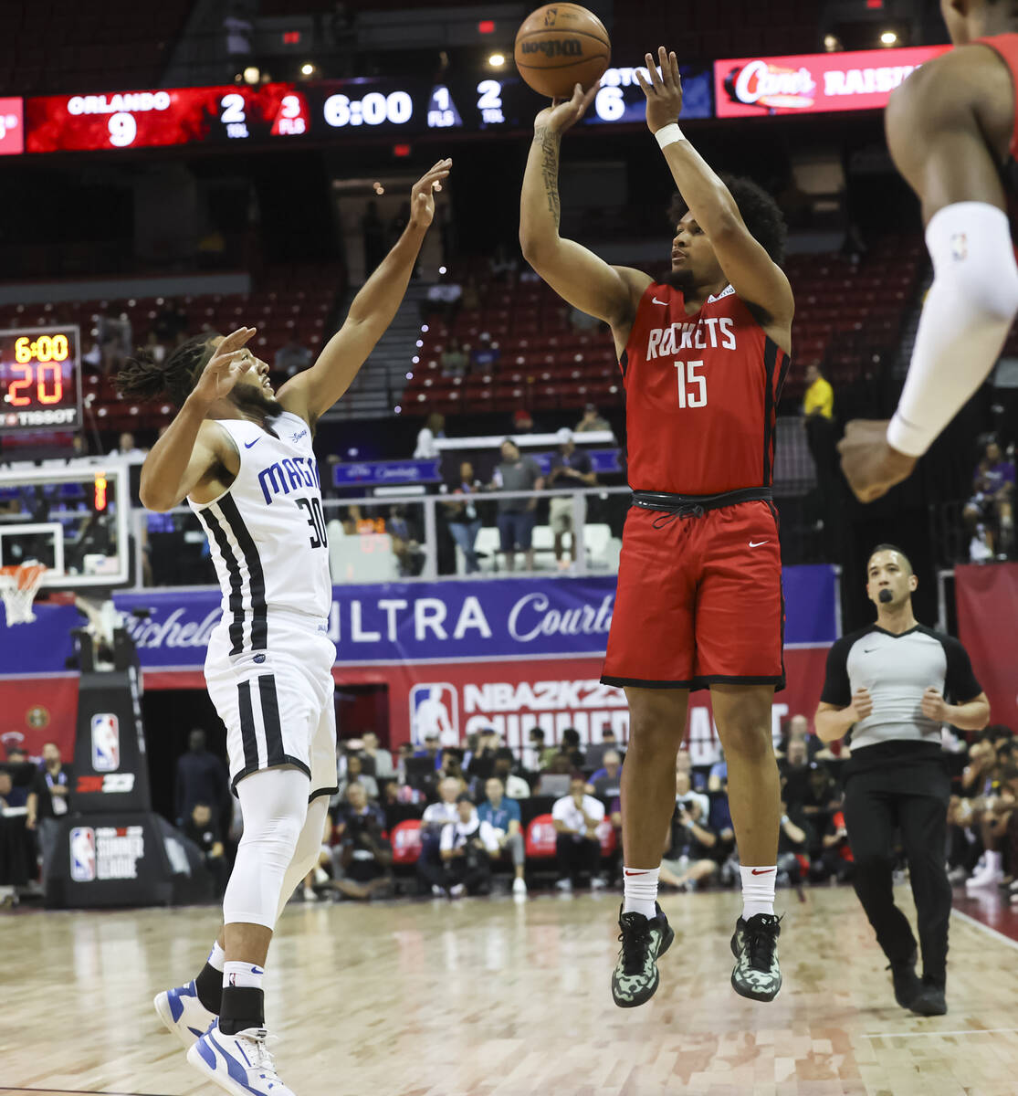Houston Rockets' Daishen Nix (15) shoots over Orlando Magic's Devin Cannady during the first ha ...