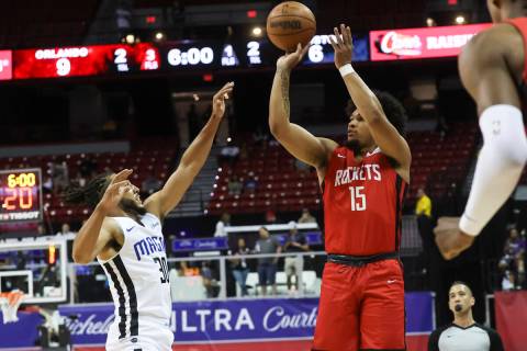 Houston Rockets' Daishen Nix (15) shoots over Orlando Magic's Devin Cannady during the first ha ...