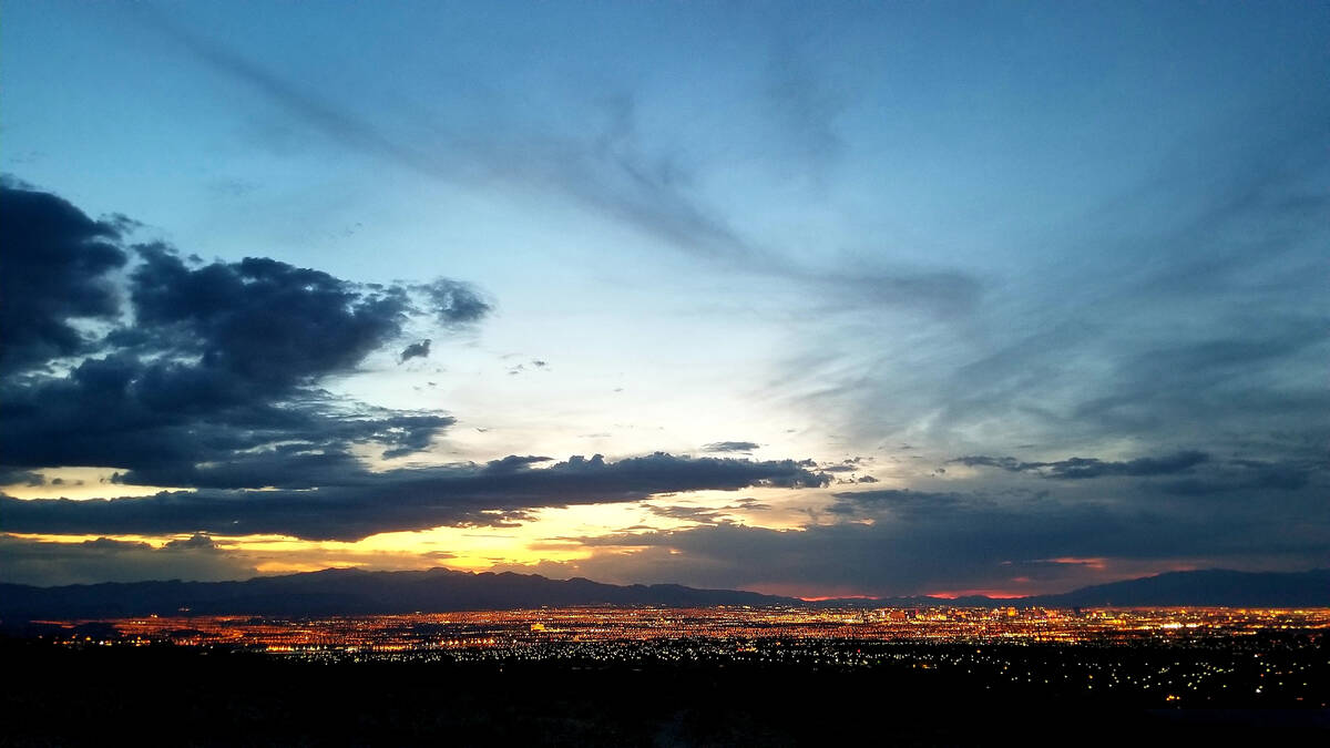 Along the trails above Anthem Hills neighborhoods, the sunset’s colors deepen and then darken ...