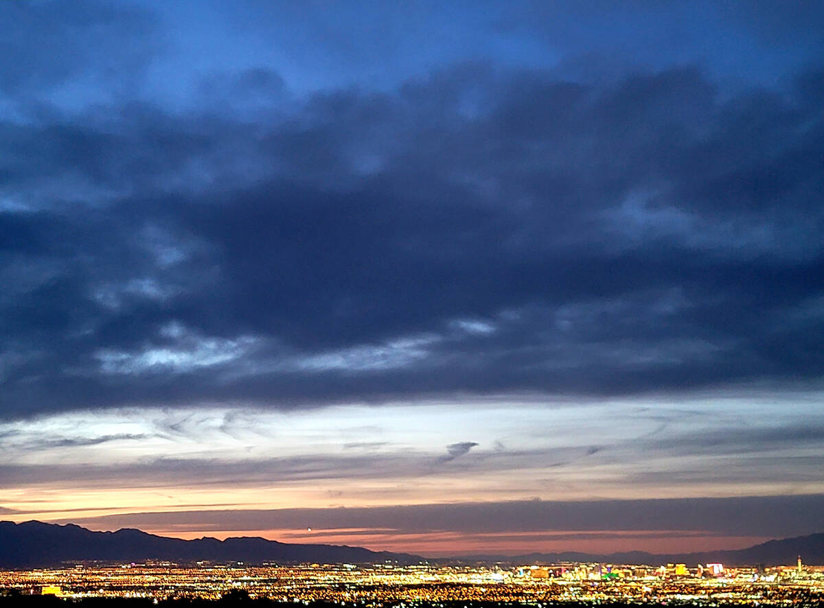 A sunset scene from a Sloan Canyon National Conservation Area vantage point earlier this year. ...