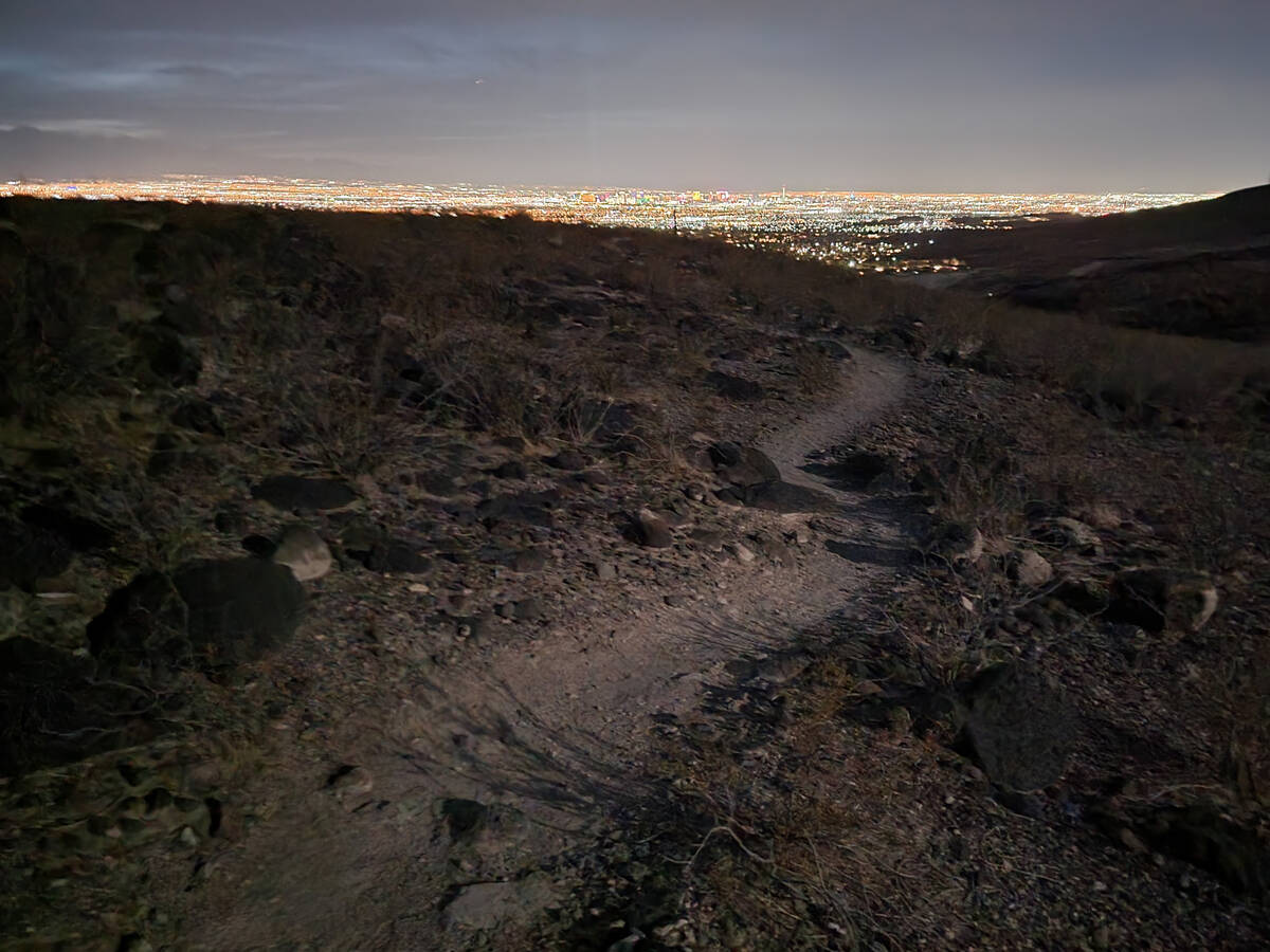 A path winds along numbered routes connected to the Shadow Canyon trailhead in Sloan Canyon Nat ...