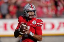 Ohio State quarterback C.J. Stroud looks to throw during the first half in the Rose Bowl NCAA c ...