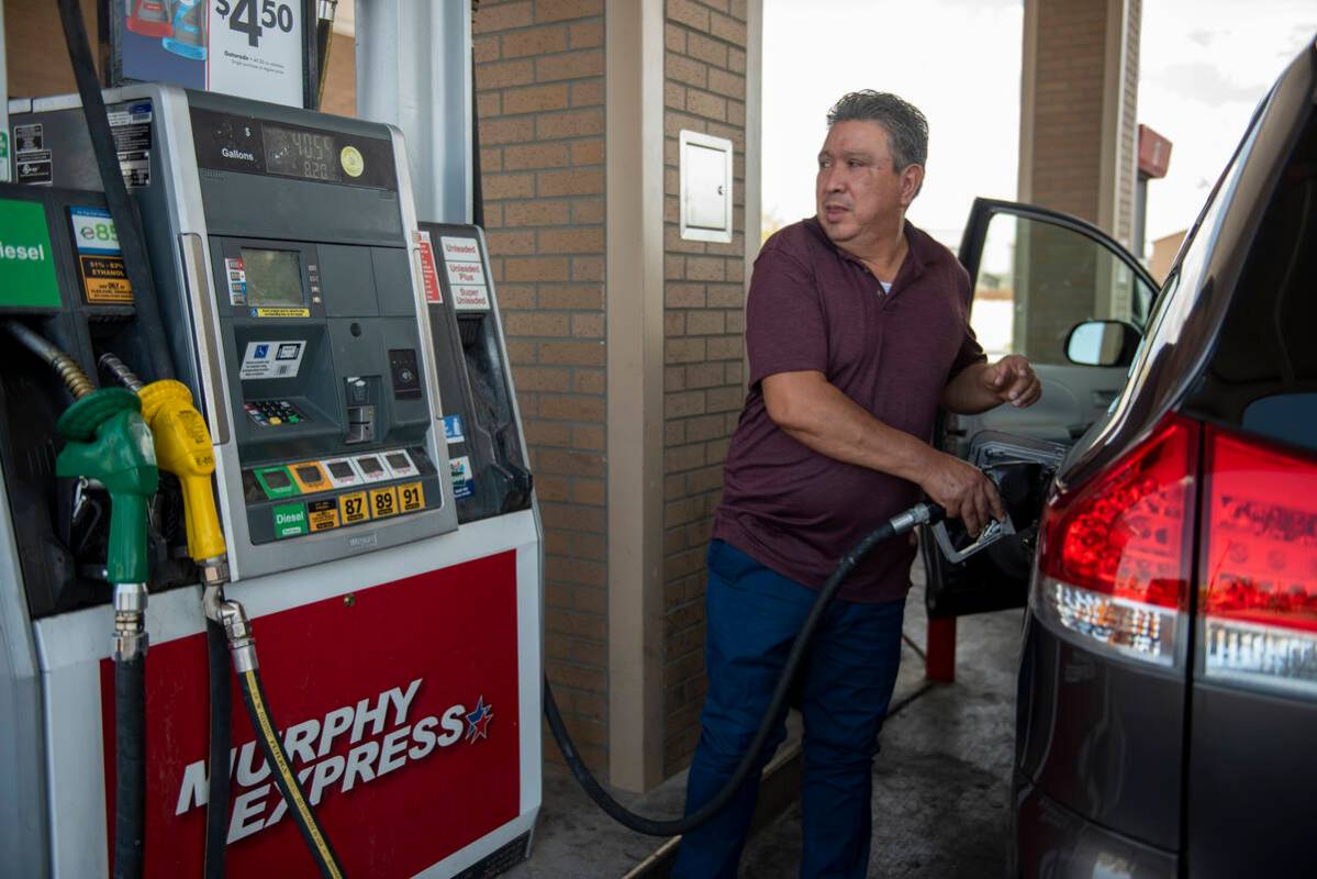 Enrique Zafra pumps gas at a Murphy Express on Craig Road on Tuesday, July 12, 2022, in Las Veg ...