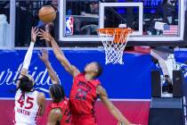 Toronto Raptors guard Dalano Banton(45) gets off a shot over the Chicago Bulls forward Justin L ...