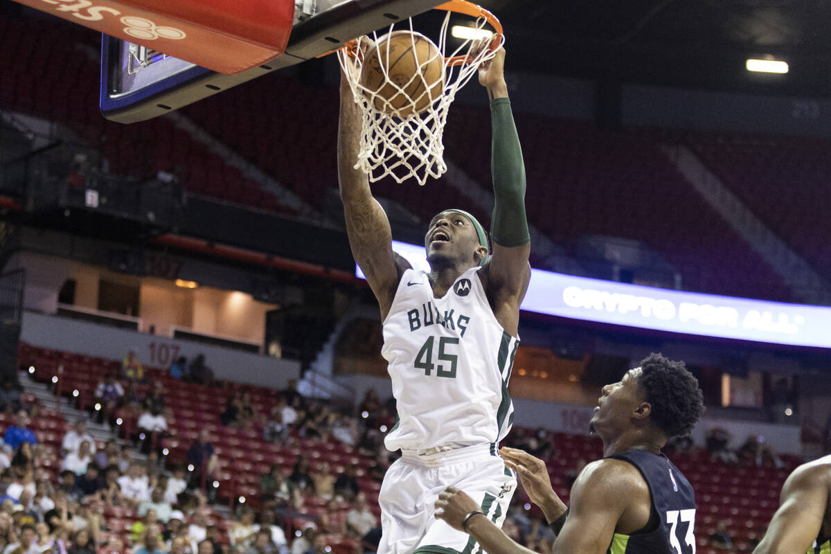 Milwaukee Bucks Zylan Cheatham (45) dunks the ball as Minnesota Timberwolves David McCormack (3 ...
