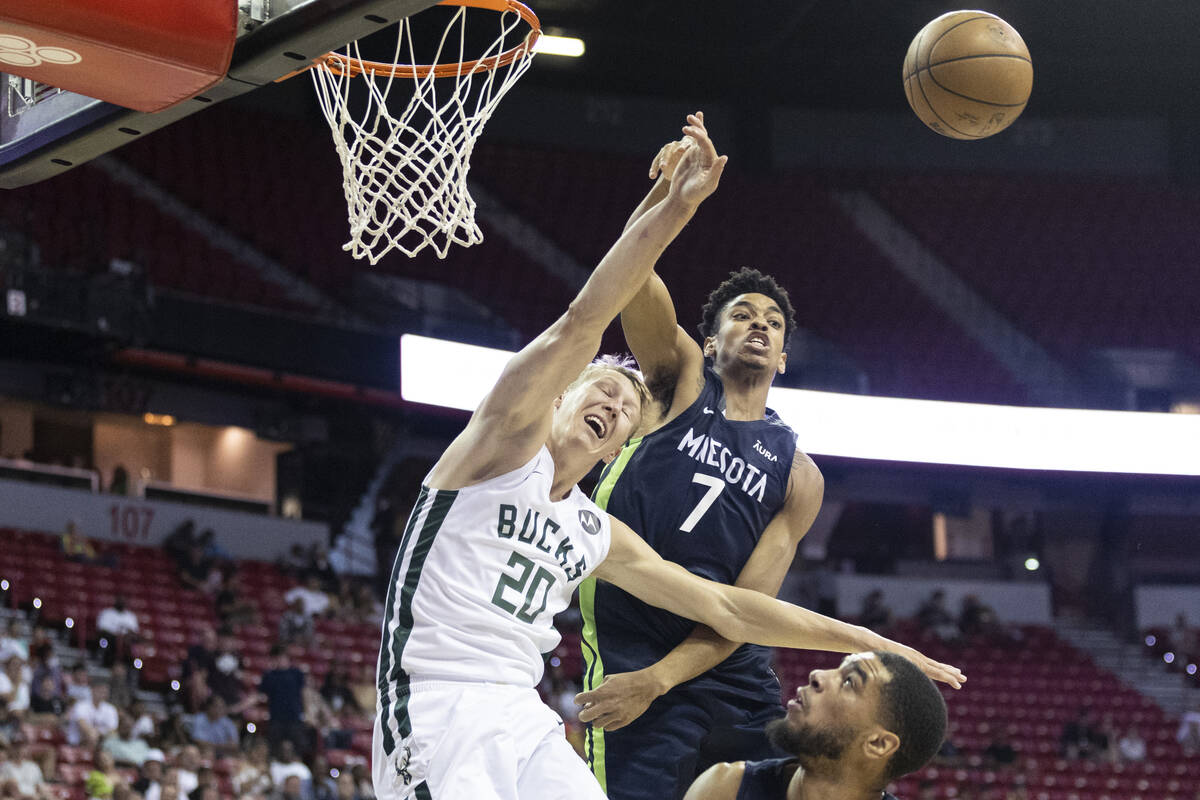 Milwaukee Bucks A.J. Green (20) gets his shot blocked by Minnesota Timberwolves Josh Minott (7) ...