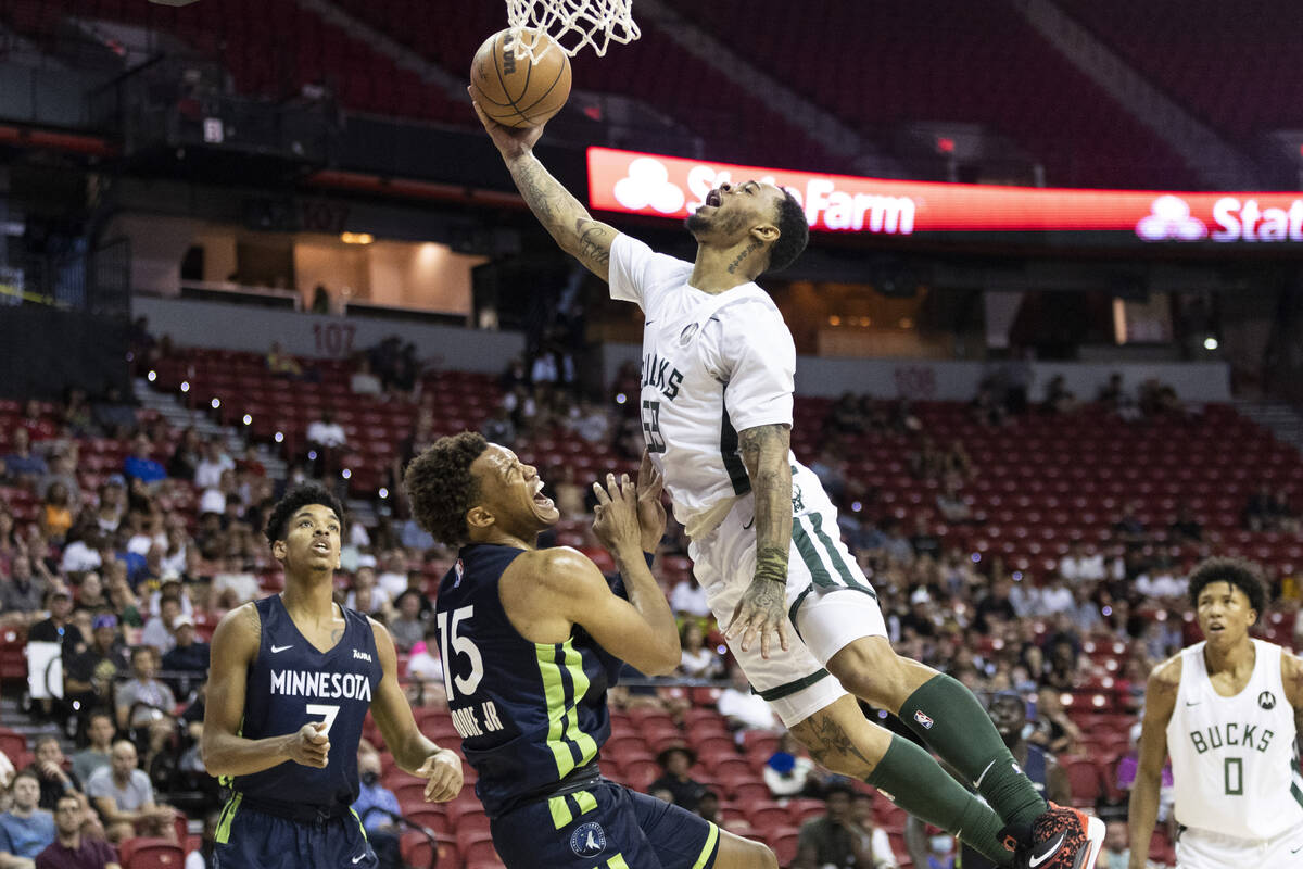 Milwaukee Bucks Rayjon Tucker (59) takes a shot over Minnesota Timberwolves Wendell Moore Jr. ( ...