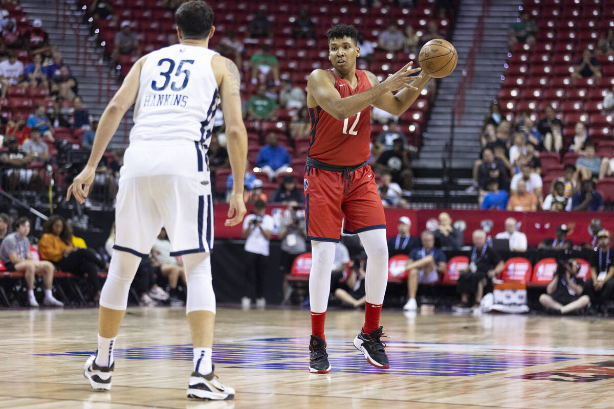 Washington Wizards' Jaime Echenique (12) grabs a pass under coverage from New Orleans Pelicans' ...