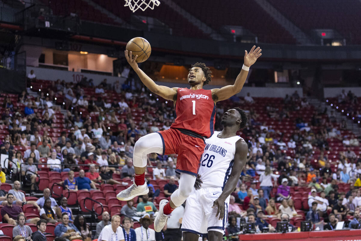 Washington Wizards' Devon Dotson (1) goes up for a shot as New Orleans Pelicans' Amadou Sow (26 ...