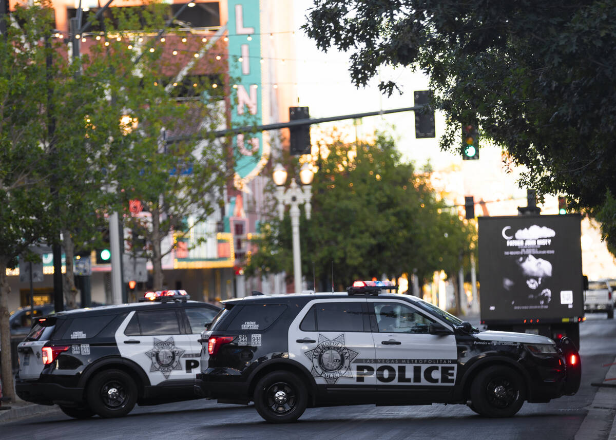 Las Vegas Metro officers park outside the Fremont Street Experience on Saturday, July 9, 2022, ...