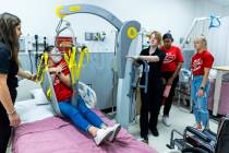 (From left) UNLV nursing student Reet Pabla ensures that participant Rockelle Aguilar is secure ...