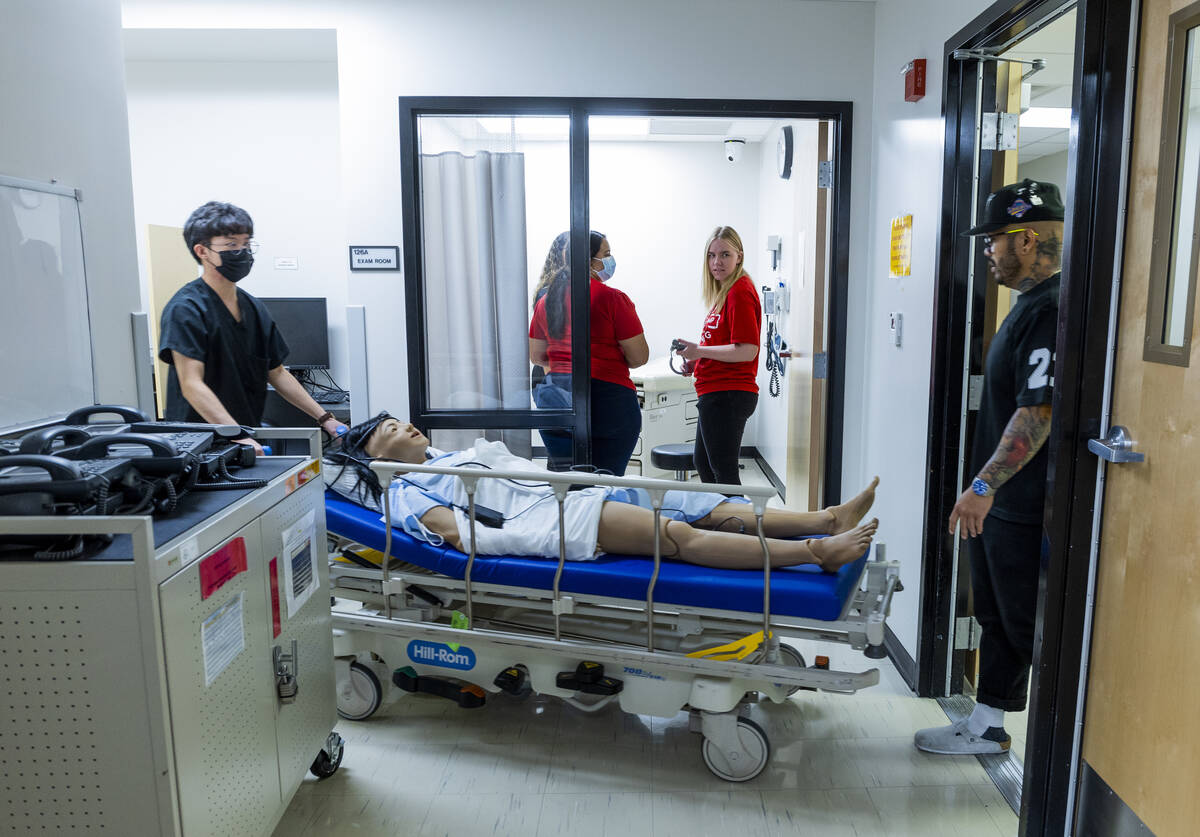 UNLV nursing students wheel in a simulation patient during the weeklong UNLV Nurse Camp at the ...