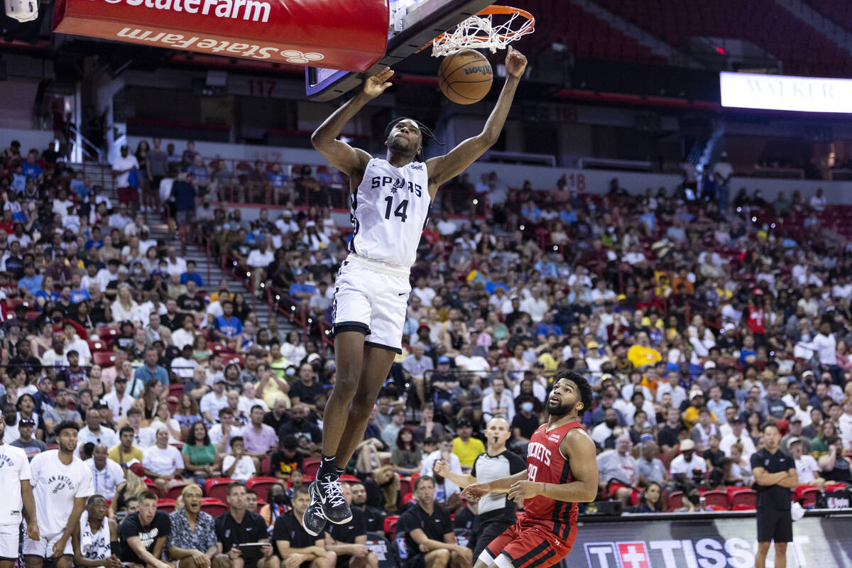 San Antonio Spurs Dominick Barlow (14) dunks the ball against the Houston Rockets during the fi ...