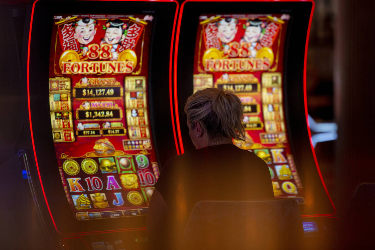 Chastity Irwin, of Dayton, Ohio, plays the slot machines at Circa on Thursday, May 19, 2022, in ...