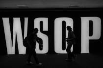 People walk by signage for the World Series of Poker at Bally’s on Tuesday, July 5, 2022 ...