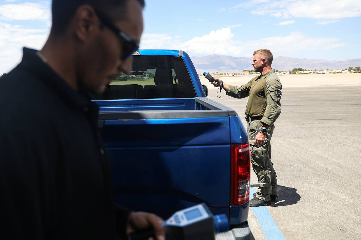 Luke Nelson, a North Las Vegas SWAT officer, right, works alongside Robert Schumann, a North La ...