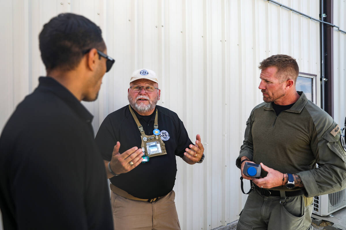 Tony Anderson, a contract instructor with Counterterrorism Operations Support, briefs Robert Sc ...