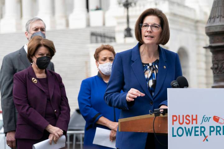 Sen. Catherine Cortez Masto, D-Nev., right, speaks about prescription drug prices during a news ...