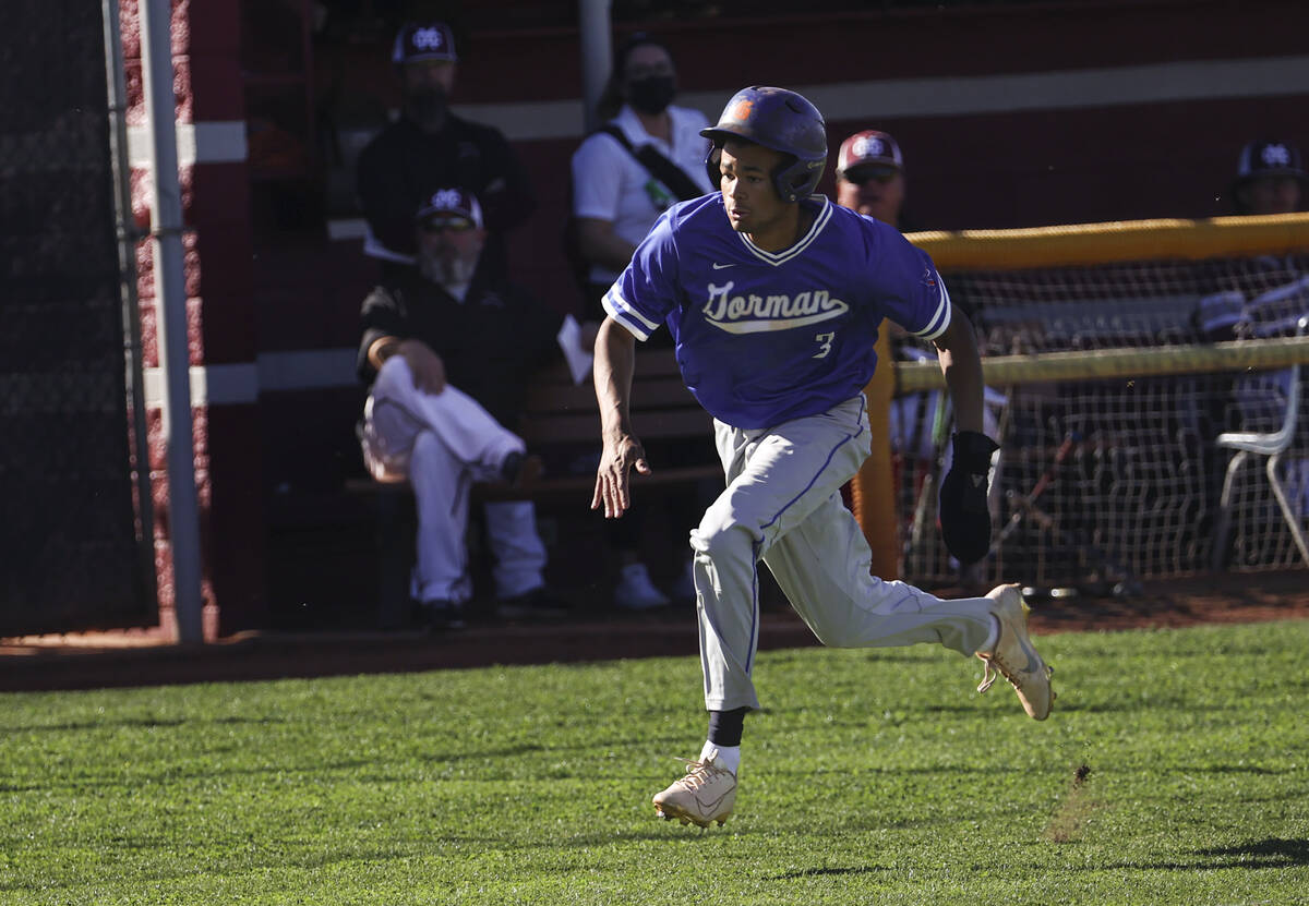 Bishop Gorman center fielder Justin Crawford (3) runs before getting tagged out by Cimarron-Mem ...