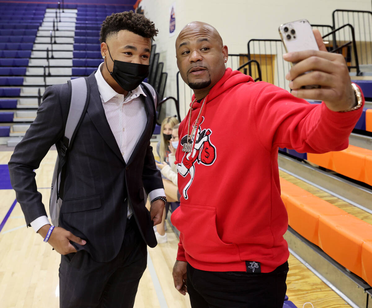 Justin Crawford poses with his father, former Major League Baseball player  Carl Crawford, befor …