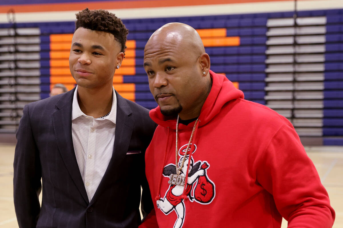 Justin Crawford poses with his father, former Major League Baseball player  Carl Crawford, after …