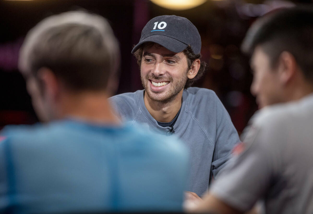 Player Philippe Souki laughs as others talk during final table play at the WSOP Main Event with ...