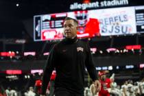 UNLV Rebels head coach Marcus Arroyo walks off the field after losing to Utah State at the end ...