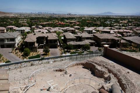 The Las Vegas strip is seen as a swimming pool is under construction in a new house in Southern ...