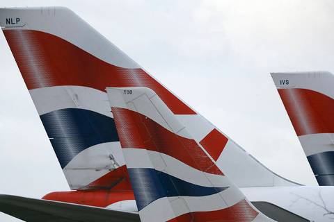 FILE - In this file photo dated Tuesday, Jan. 10, 2017, British Airways planes are parked at He ...
