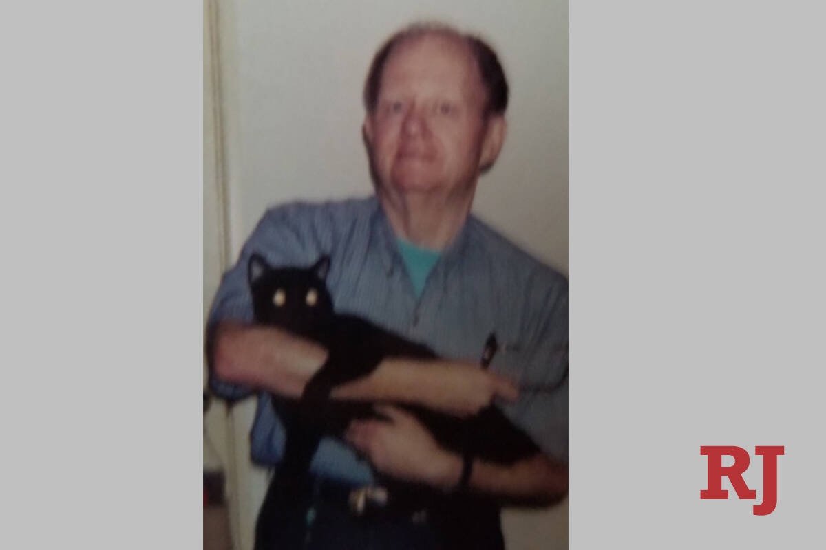 Larry Thomas holds Charlie. (Family photo)