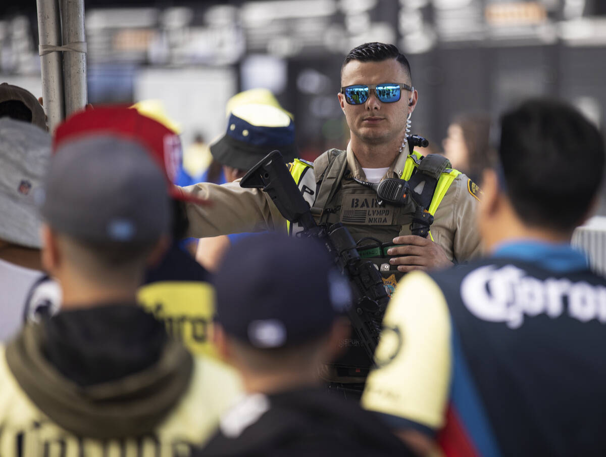 Fans pass through security at Allegiant Stadium before the start of a soccer game between Chels ...