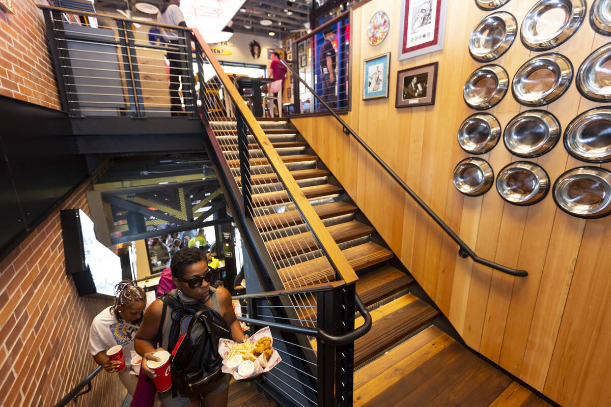 People dine-in during the grand opening of the Raising Cane’s restaurant in the Showcase ...