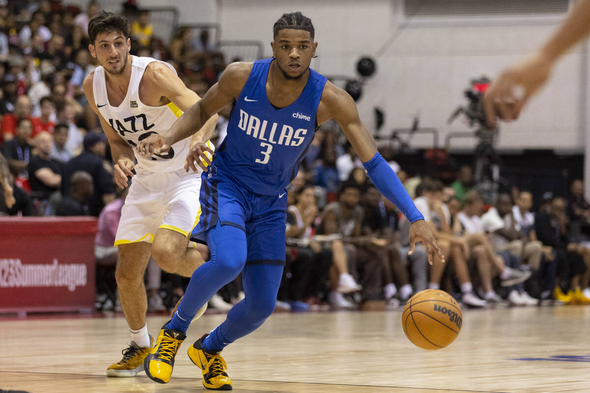 Dallas Mavericks Jaden Hardy (3) dribbles past Utah Jazz Leandro Bolmaro (10) during the first ...