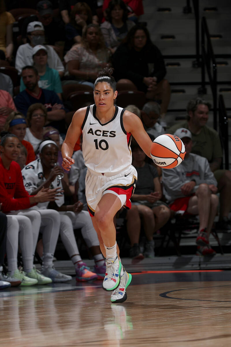 Kelsey Plum #10 of the Las Vegas Aces dribbles the ball during the game against the Connecticut ...