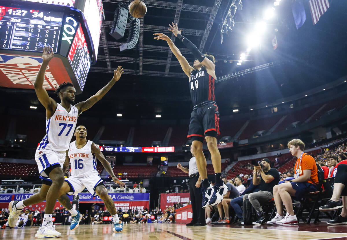 Portland Trail Blazers' Colbey Ross shoots over New York Knicks' Jean Montero (77) during the f ...