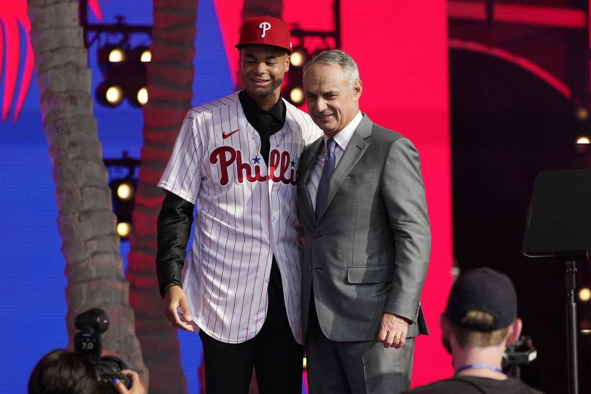 Justin Crawford, left, poses for photos with MLB Commissioner Rob Manfred after being selected ...