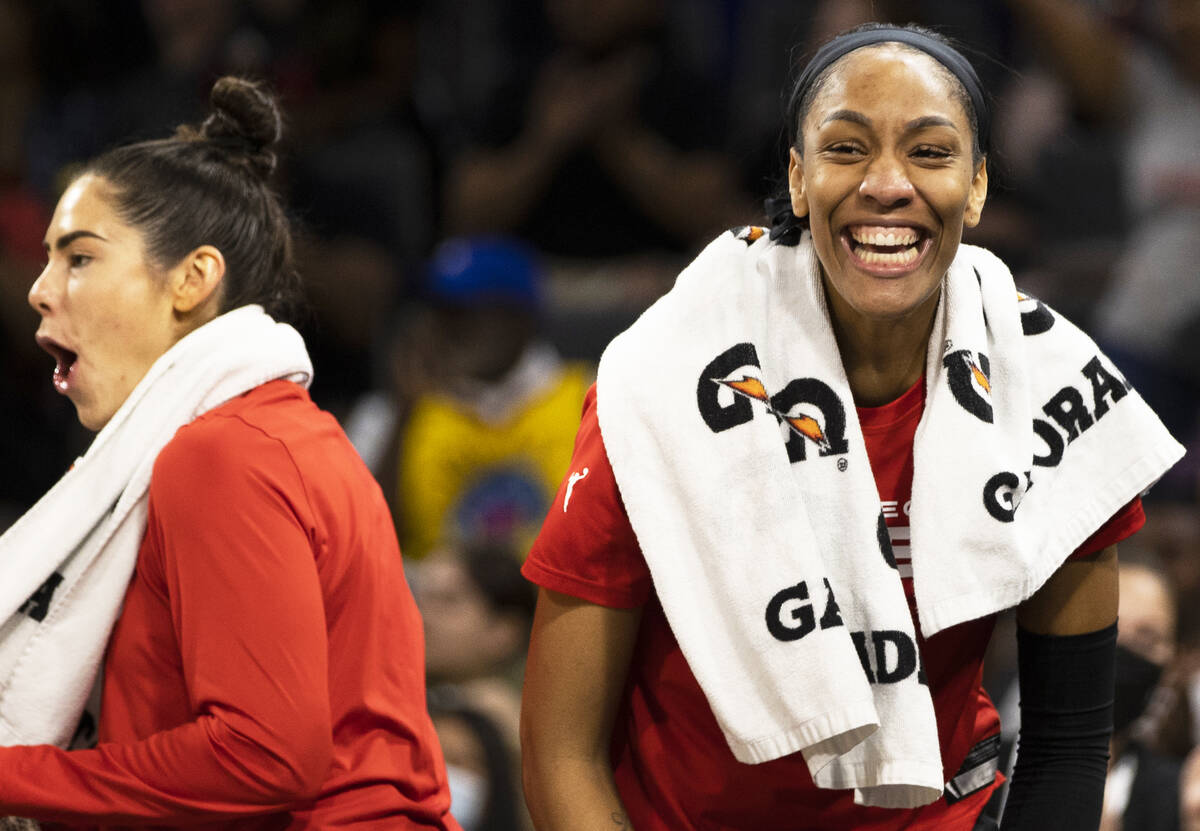 Aces forward A'ja Wilson (22) and Aces guard Kelsey Plum (10) react to a big offensive play in ...