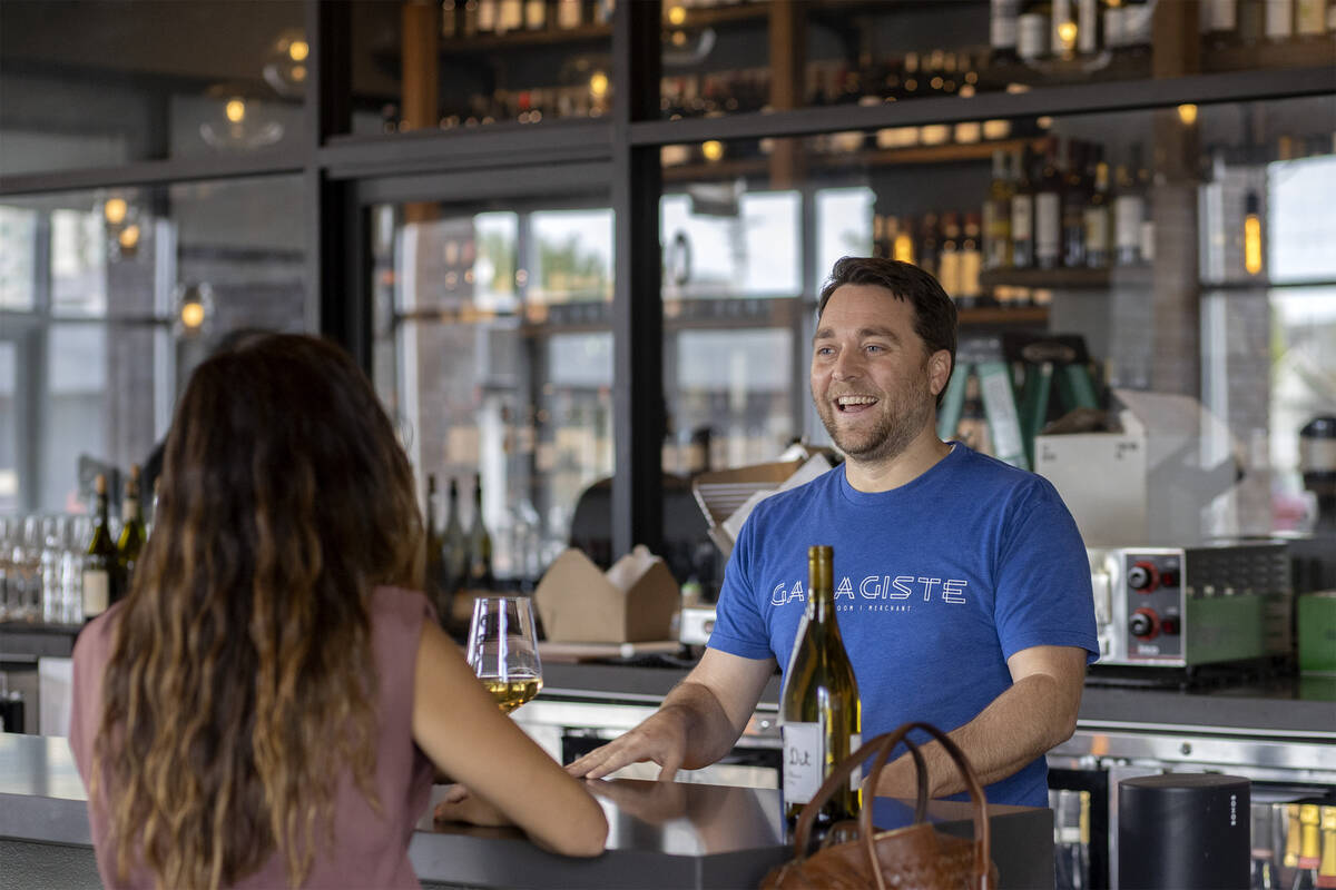 Sommelier and owner of Garagiste, Eric Prato, chats with a guest at the downtown wine bar and b ...