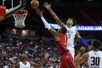 Houston Rockets' Jabari Smith (1) lays up the ball against Orlando Magic's Paolo Banchero (5) d ...