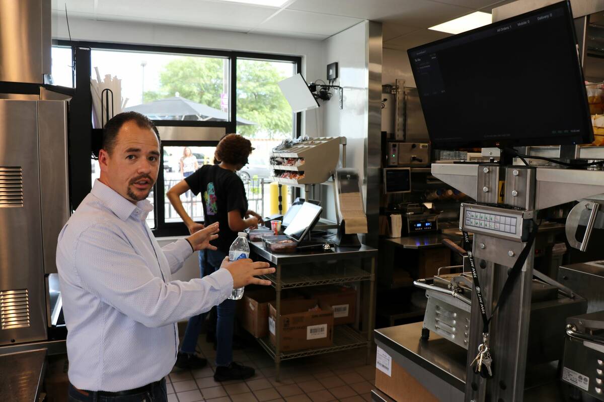 Diversified Restaurant Group Director of Operations Geno Woolard inside the Taco Bell Go Mobile ...
