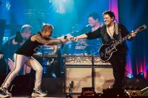 Arnel Pineda and Neal Schon of Journey perform at Resorts World Theatre on Saturday, July 16, 2 ...