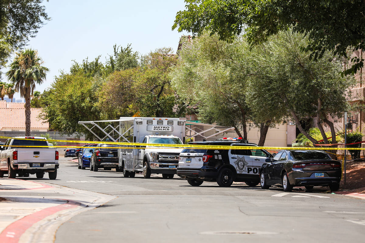 Police at scene of a homicide in the 2500 block of Perryville Avenue in Las Vegas, Sunday, July ...