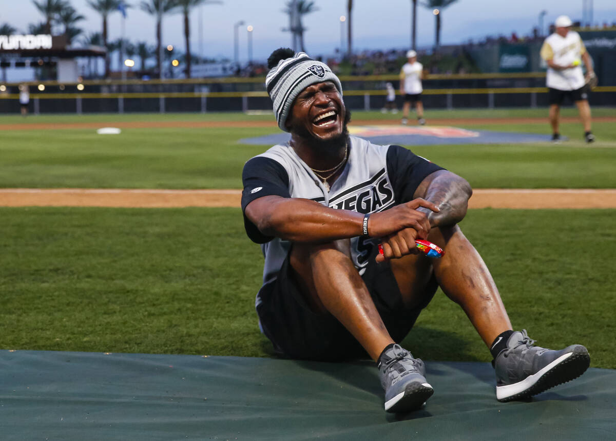 Raiders’ Denzel Perryman reacts during a break in the Battle for Vegas charity softball ...