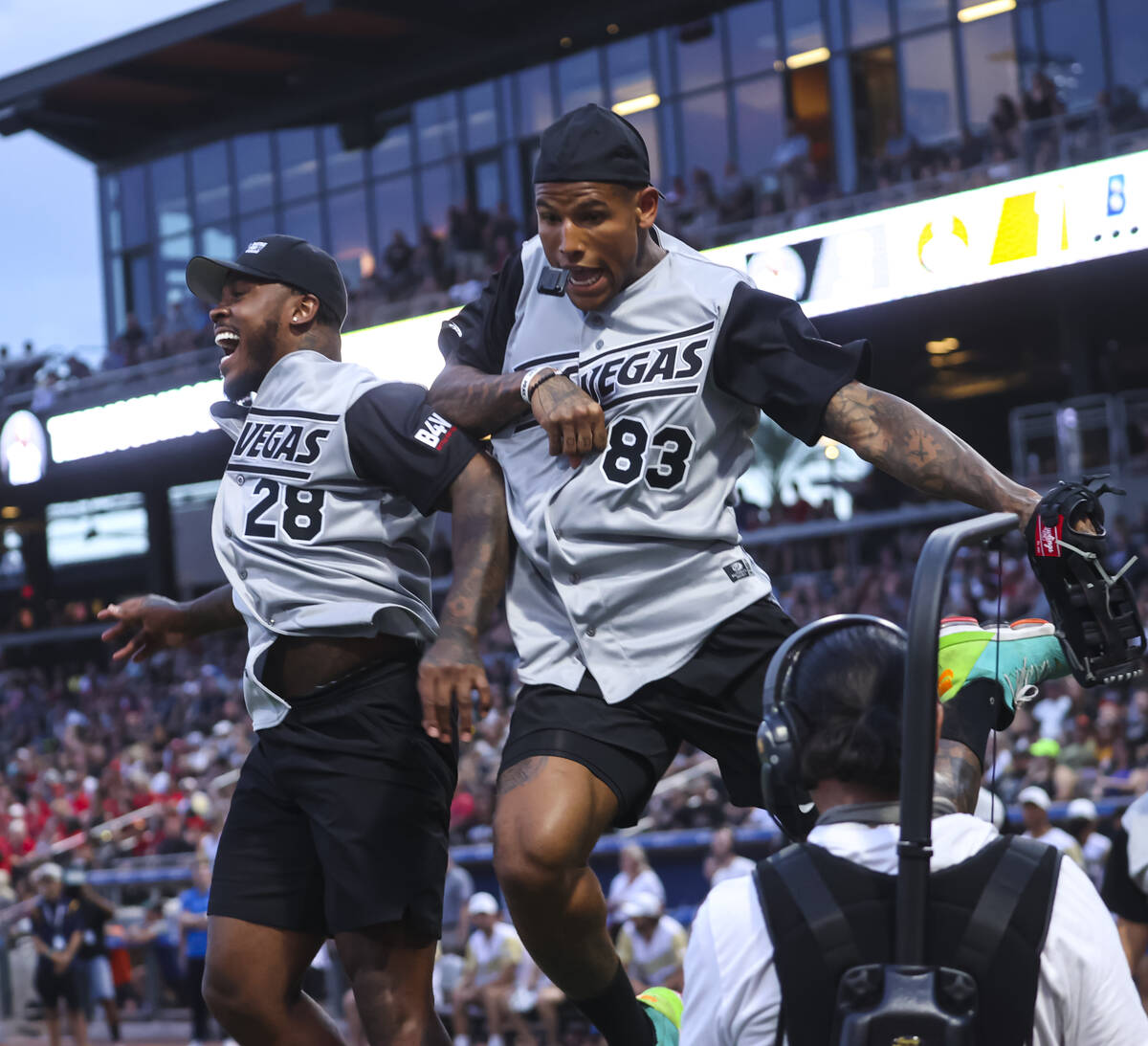 Raiders’ Darren Waller (83) celebrates his home run with Josh Jacobs during the Battle f ...