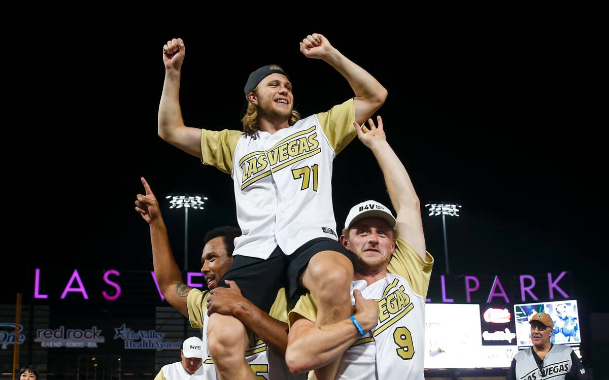 Golden Knights’ William Karlsson, who won MVP, is lifted up on the shoulders of Keegan Kolesa ...